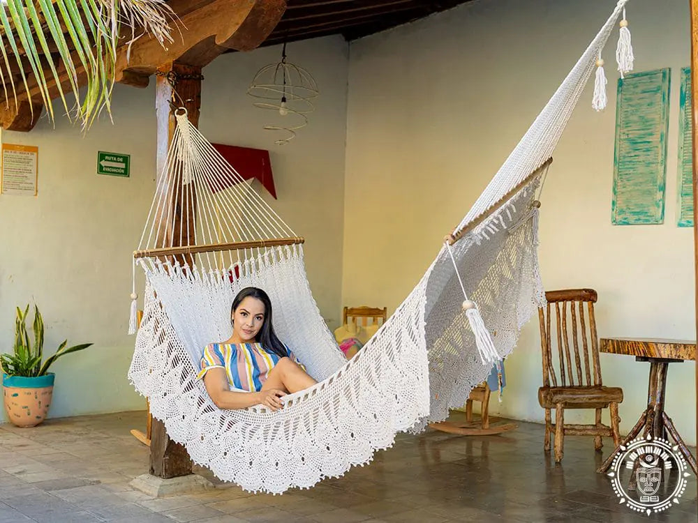 Hand-woven Deluxe Masaya cotton spreader bar hammock with decorative fringe and wooden bars