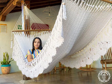 Hand-woven Deluxe Masaya cotton spreader bar hammock with decorative fringe and wooden bars