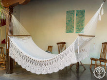 Hand-woven Deluxe Masaya cotton spreader bar hammock with decorative fringe and wooden bars
