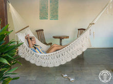 Hand-woven Deluxe Masaya cotton spreader bar hammock with decorative fringe and wooden bars