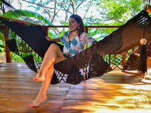 Black cotton L-bar hammock with wooden spreader bars