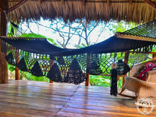 Black cotton L-bar hammock with wooden spreader bars