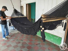 Black cotton L-bar hammock with wooden spreader bars