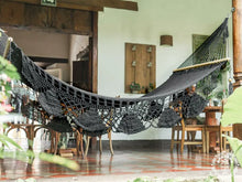 Black cotton L-bar hammock with wooden spreader bars