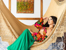 Handwoven León Deluxe L-bar cotton hammock with wooden spreader bars and decorative fringe