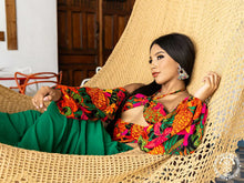 Handwoven León Deluxe L-bar cotton hammock with wooden spreader bars and decorative fringe