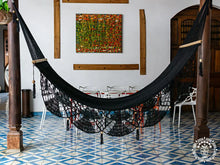 Black cotton L-bar hammock with wooden spreader bars