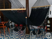 Black cotton L-bar hammock with wooden spreader bars
