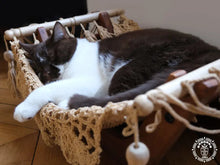 Taupe cat hammock with wooden stand for a cosy raised pet bed
