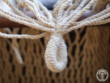 Taupe cat hammock with wooden stand for a cosy raised pet bed