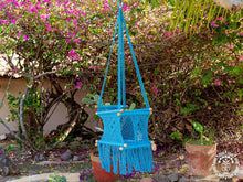 Blue hand-woven macramé baby hammock chair made from cotton