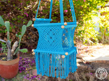 Blue hand-woven macramé baby hammock chair made from cotton
