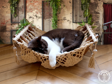 Taupe cat hammock with wooden stand for a cosy raised pet bed