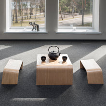 Japanese style wooden tea table and two bench stools for meditation and tea ceremony