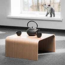 Japanese style wooden tea table and two bench stools for meditation and tea ceremony