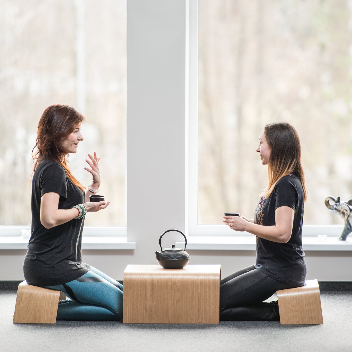 Japanese style wooden tea table and two bench stools for meditation and tea ceremony
