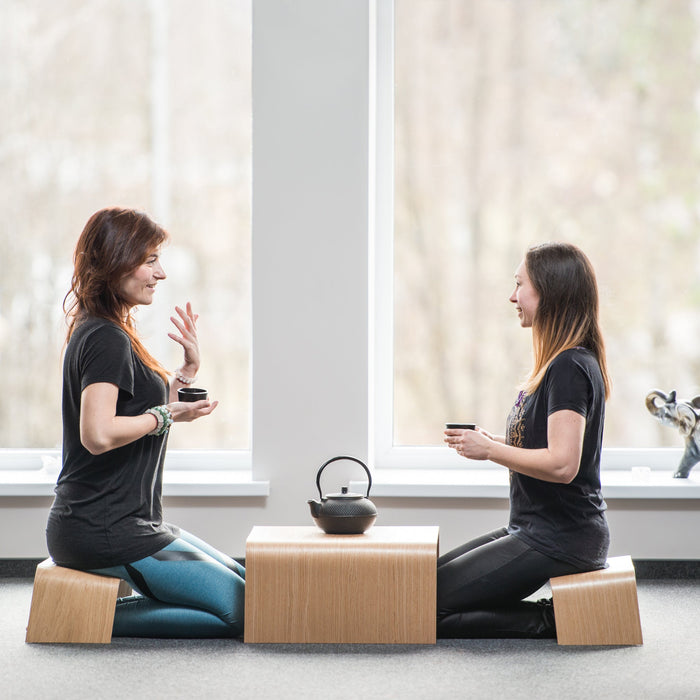 Japanese style wooden tea table and two bench stools for meditation and tea ceremony