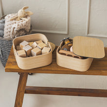 Set of two natural oak wooden storage boxes with lids for home organisation
