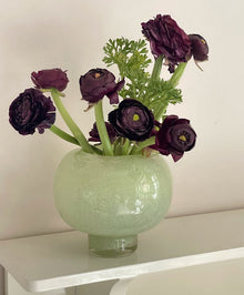 Green round glass vase for flowers and home decor