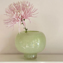Green round glass vase for flowers and home decor