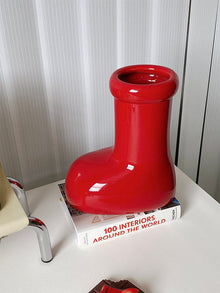 Red boot-shaped ceramic flower vase for home decor
