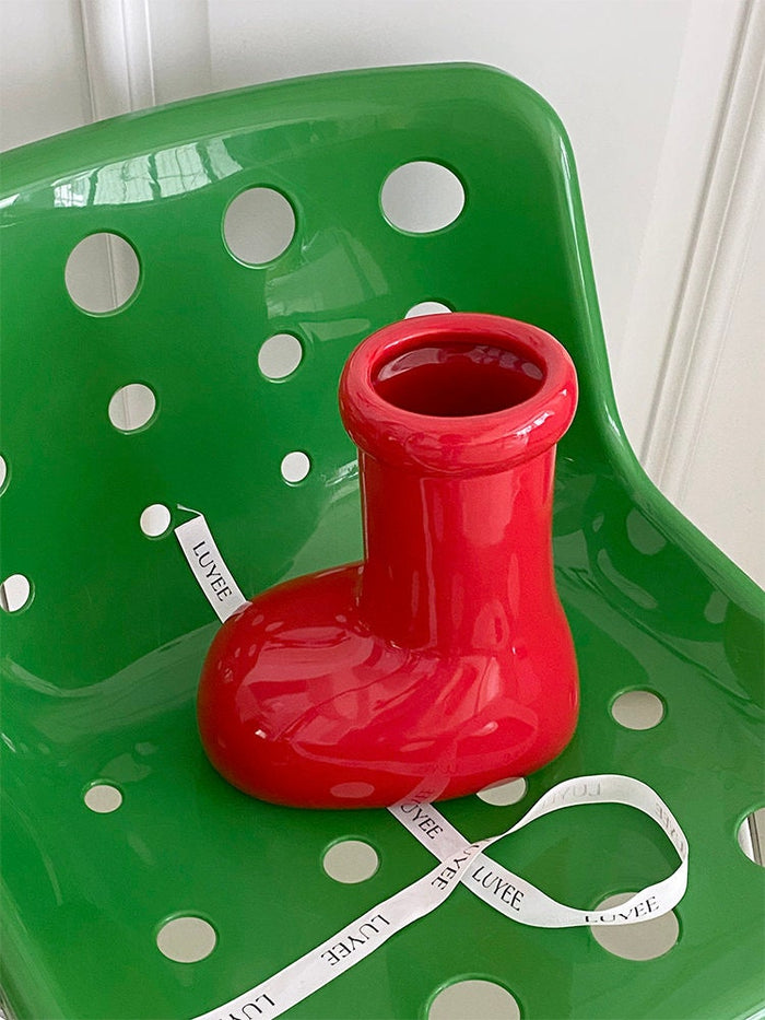 Red boot-shaped ceramic flower vase for home decor