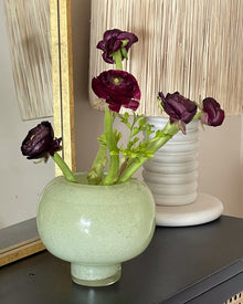 Green round glass vase for flowers and home decor