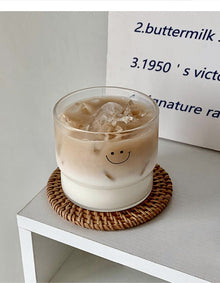 Cute face glass coffee cup with playful design