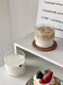 Cute face glass coffee cup with playful design