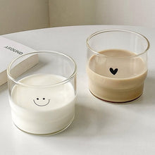 Cute face glass coffee cup with playful design