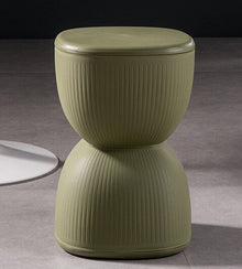 Yellow striped plastic stool and plant stand for home decor