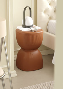 Yellow striped plastic stool and plant stand for home decor