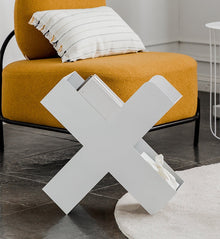Orange X-shaped metal bookshelf for books, magazines, and home decor