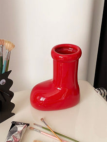 Red boot-shaped ceramic flower vase for home decor