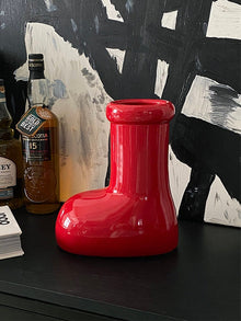 Red boot-shaped ceramic flower vase for home decor