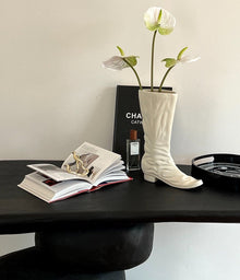 Boot-shaped ceramic flower vase for decorative home styling