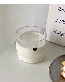 Cute face glass coffee cup with playful design