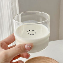 Cute face glass coffee cup with playful design