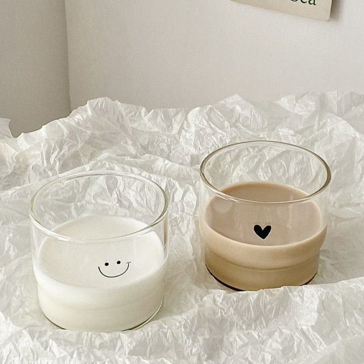 Cute face glass coffee cup with playful design