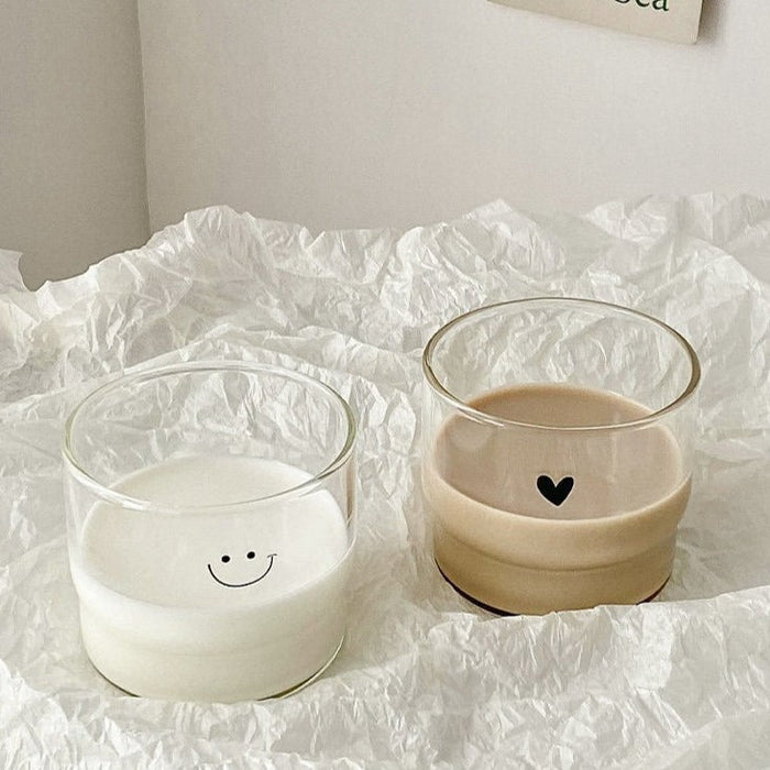 Cute face glass coffee cup with playful design