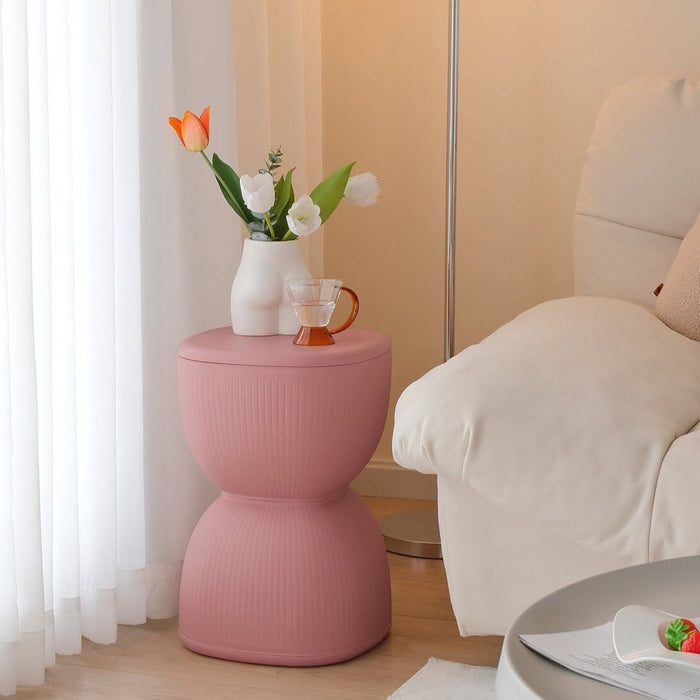 Yellow striped plastic stool and plant stand for home decor