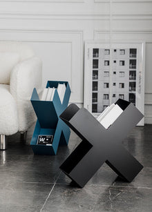 Orange X-shaped metal bookshelf for books, magazines, and home decor