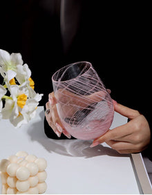 Starry pink glass cup with decorative star pattern