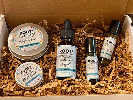New baby herbal care gift set with cord powder, diaper salve, rollers, and herbal extract