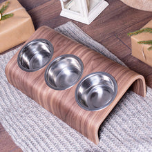 Wooden elevated pet bowl stand with three stainless steel bowls in oak finish