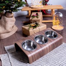 Wooden elevated pet bowl stand with three stainless steel bowls in oak finish