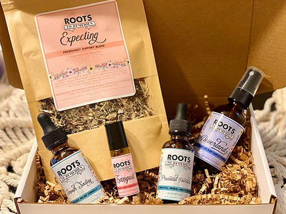 Pregnancy wellness gift set with herbal tea, extracts, roller, and magnesium spray