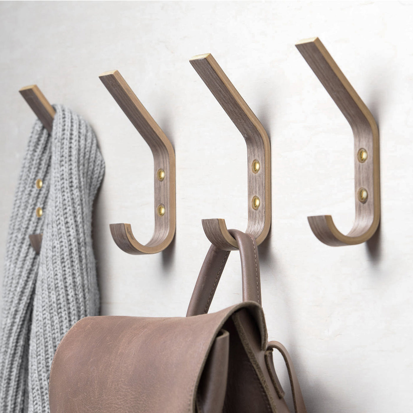 Set of four walnut wooden wall hooks for coats, bags, hats, and everyday home storage