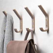 Set of four walnut wooden wall hooks for coats, bags, hats, and everyday home storage