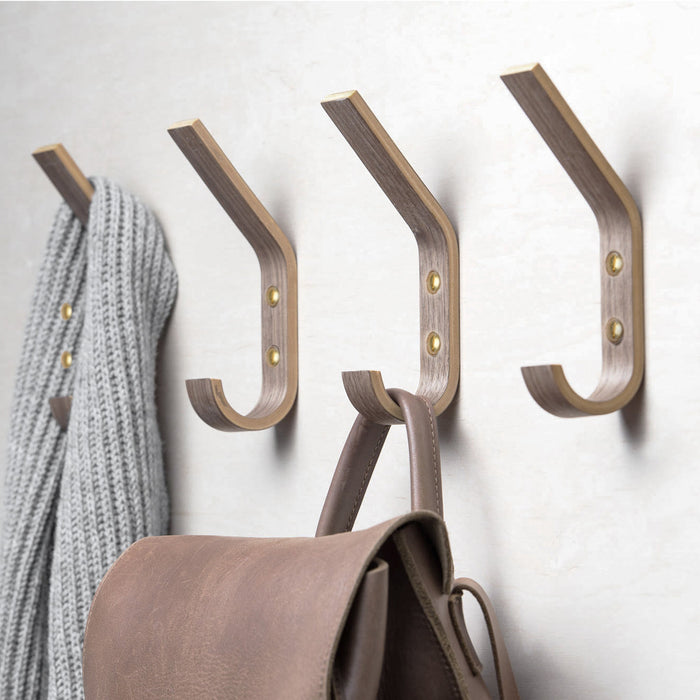 Set of four walnut wooden wall hooks for coats, bags, hats, and everyday home storage